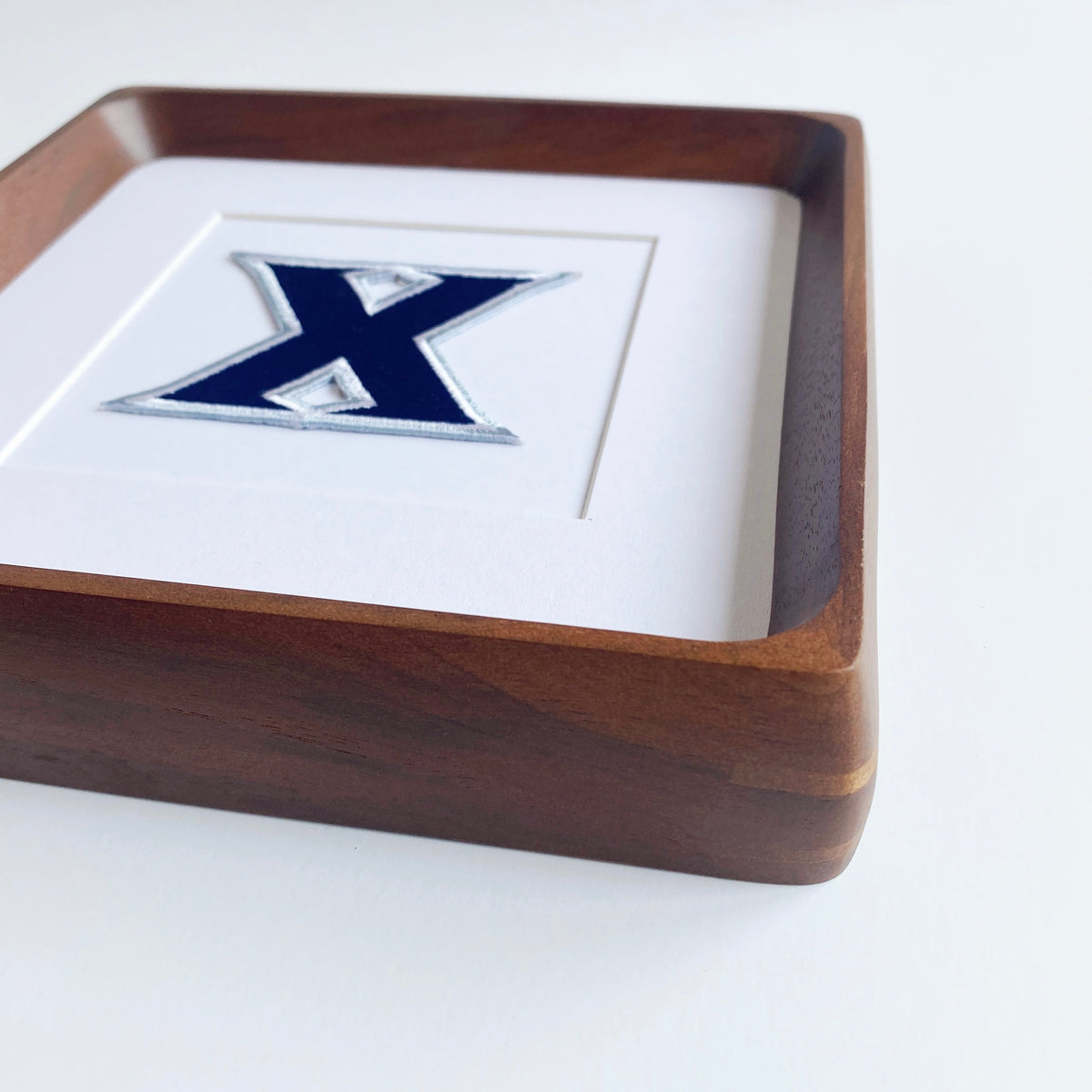 framed xavier musketeer vintage patch