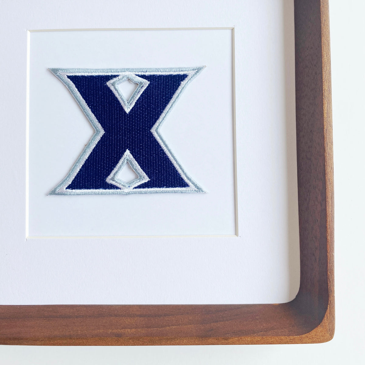 framed xavier musketeer vintage patch