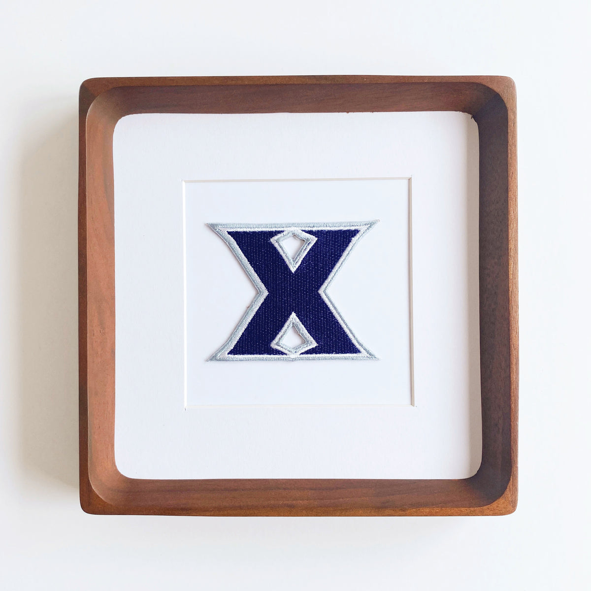 framed xavier musketeer vintage patch