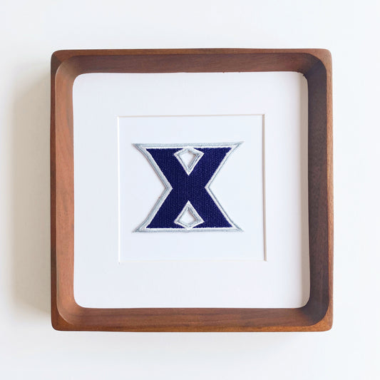 framed xavier musketeer vintage patch